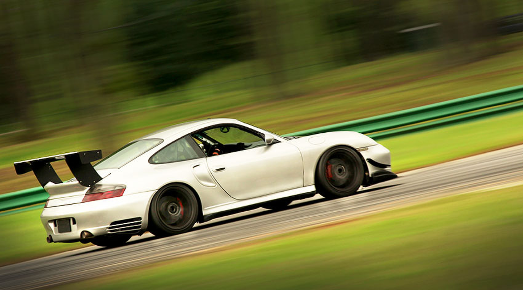 Sports car blurring past on a track