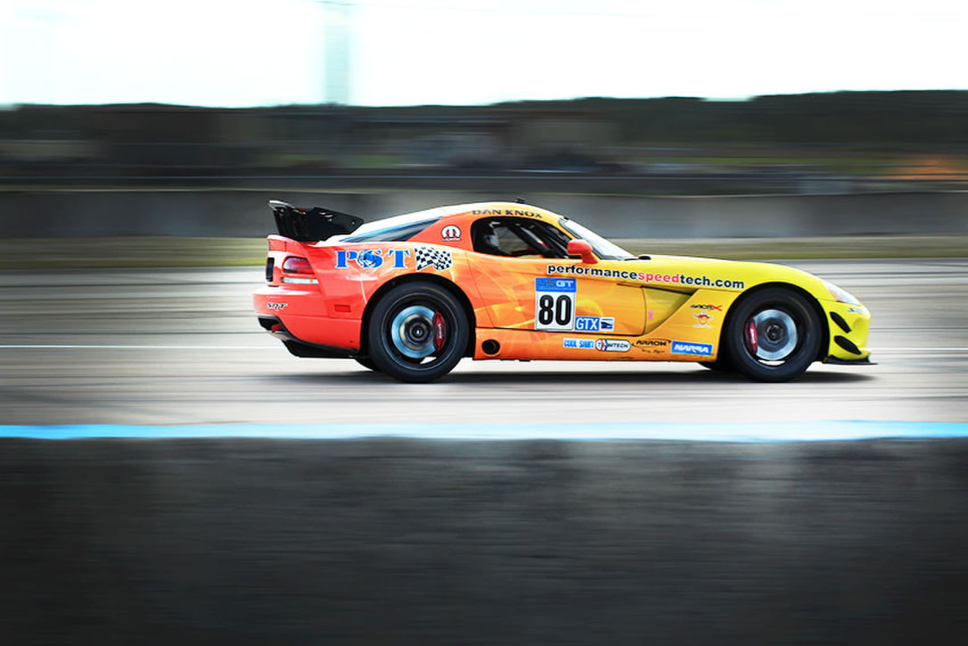 Orange and yellow Viper #80 PST livery on the straightaway